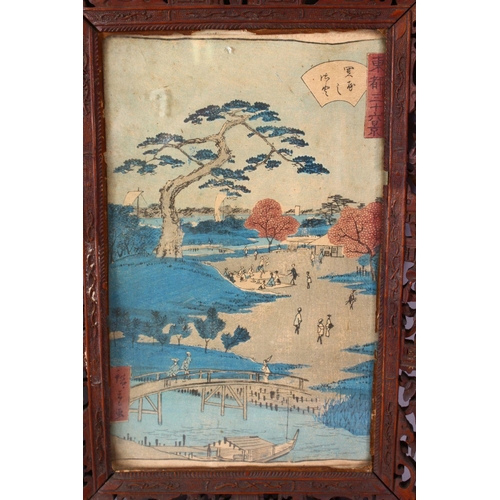 296 - A PAIR OF 19TH CENTURY CHINESE CARVED WOODEN FRAMES AND JAPANESE WOODBLOCK PRINTS, the frames carved... 