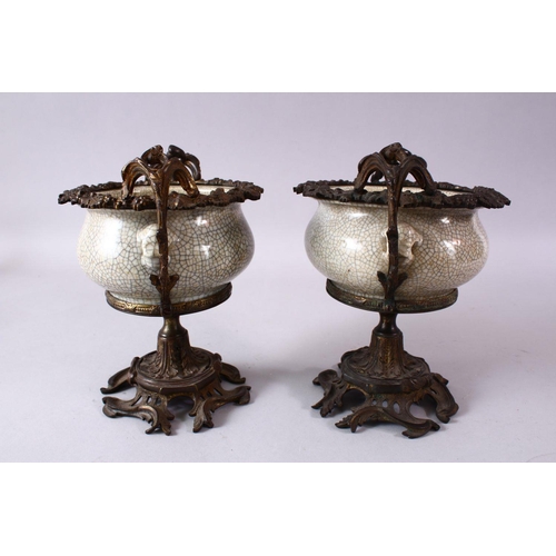 299 - A PAIR OF 19TH/20TH CENTURY CHINESE GUAN WARE POTTERY BOWLS with ormolu mounts, the bowls with mould... 