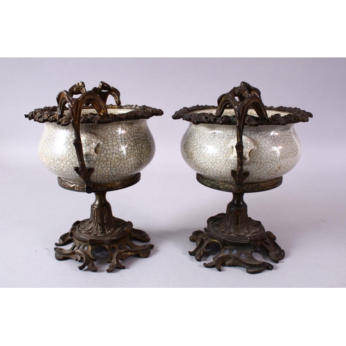 299 - A PAIR OF 19TH/20TH CENTURY CHINESE GUAN WARE POTTERY BOWLS with ormolu mounts, the bowls with mould... 