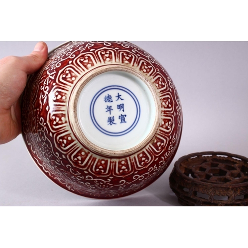 306 - A CHINESE COPPER RED CARVED COPPER RED PORCELAIN DRAGON BOWL, with decoration of dragins amongst flo... 