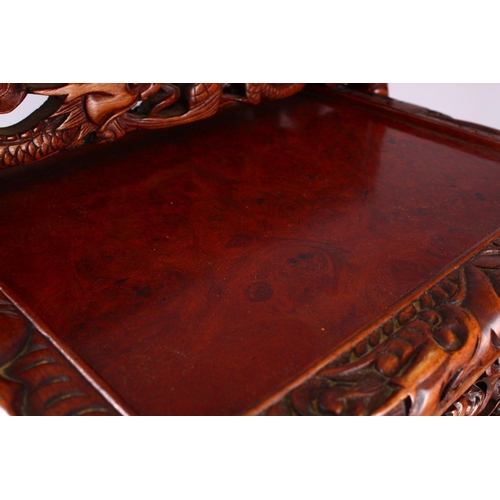 325 - A FINE 19TH / 20TH CENTURY CHINESE CARVED HARD WOOD NEST OF FOUR DRAGON & BAT TABLES, the tops with ... 