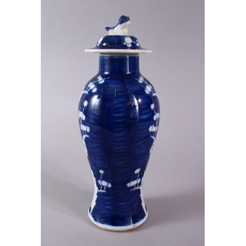 328 - A 19TH CENTURY CHINESE BLUE & WHITE PORCELAIN PRUNUS VASE & COVER, the body decorated with prunus de... 