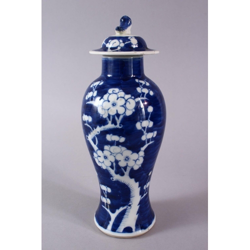 328 - A 19TH CENTURY CHINESE BLUE & WHITE PORCELAIN PRUNUS VASE & COVER, the body decorated with prunus de... 