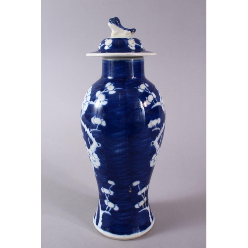 328 - A 19TH CENTURY CHINESE BLUE & WHITE PORCELAIN PRUNUS VASE & COVER, the body decorated with prunus de... 