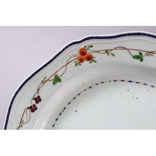 329 - A FINE CHINESE 18TH CENTURY FAMILLE ROSE EXPORT PORCELAIN SERVING DISH, with typical floral borders ... 