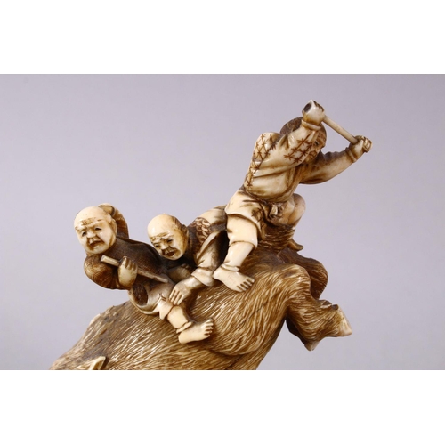 34 - A JAPANESE MEIJI PERIOD CARVED IVORY OKIMONO GROUP- depicting a boar being attacked by numerous figu... 