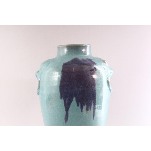 345 - A CHINESE PURPLE SPLASH POTTERY VASE, with moulded lion mask handles, 35cm high.