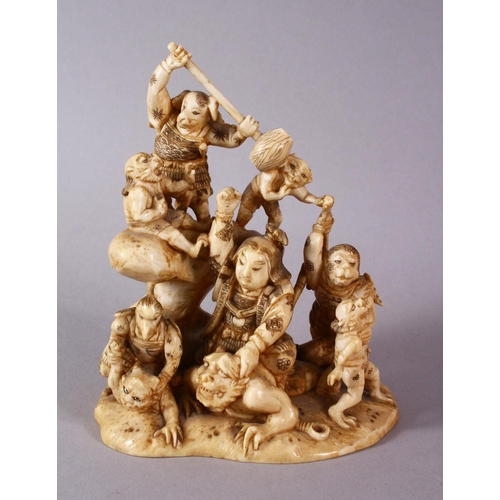 35 - A JAPANESE MEIJI PERIOD CARVED IVORY OKIMONO GROUP - depicting figures attacking oni demons, one dog... 