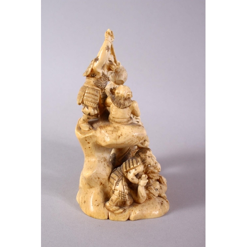 35 - A JAPANESE MEIJI PERIOD CARVED IVORY OKIMONO GROUP - depicting figures attacking oni demons, one dog... 