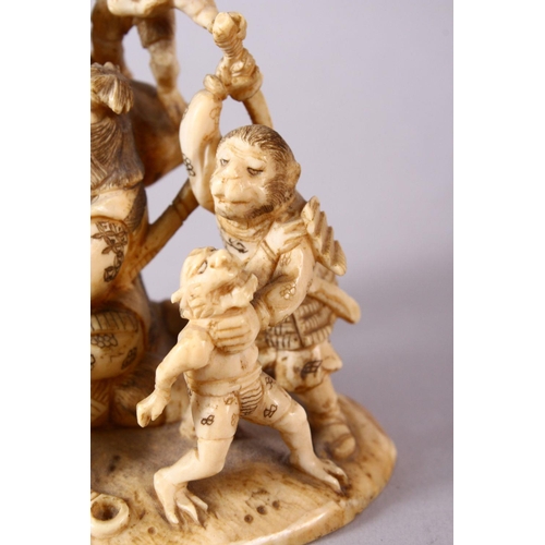 35 - A JAPANESE MEIJI PERIOD CARVED IVORY OKIMONO GROUP - depicting figures attacking oni demons, one dog... 