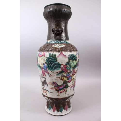 37 - A 19TH CENTURY CHINESE FAMILLE ROSE CRACKLE GLAZED PORCELAIN VASE, painted with a battle scene, the ... 