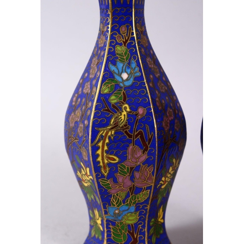 43 - A 19TH / 20TH CENTURY CHINESE CLOISONNE VASES, with wirework depicting floral spray upon a blue grou... 