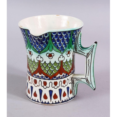 603 - A 19TH CENTURY IZNIK STYLE CANTAGALLI JUG, with floral panel motif, 10cm.