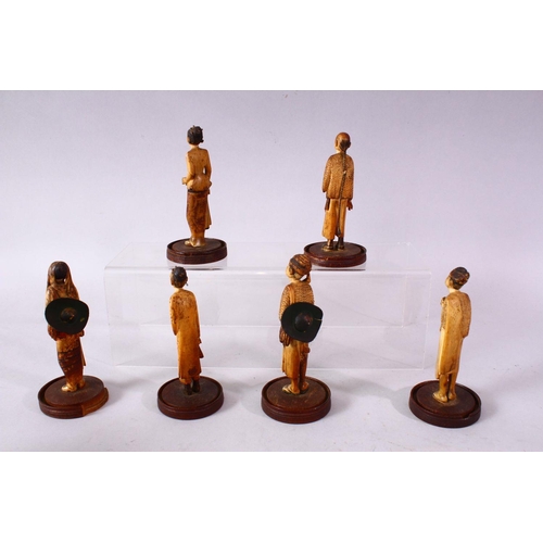 609 - A SET OF SIX 18TH/19TH CENTURY ORIENTAL/EASTERN CARVED AND STAINED IVORY FIGURES, each depicting a n... 