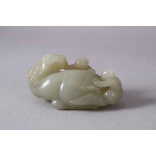 61 - A CHINESE CARVED JADE FIGURE OF AN OXEN AND ATTENDANTs, The oxen in a recumbent position with two yo... 