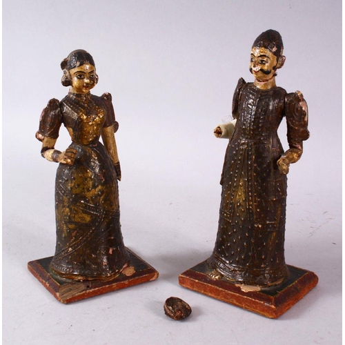 612 - TWO PERSIAN LACQUERED WOOD FIGURES, (AF), 18.5cm high.