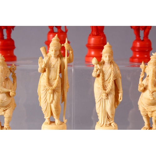 615 - AN EARLY 20TH CENTURY IVORY AND STAINED IVORY INDIAN CHESS SET, carved as Indian gods and temples, l... 