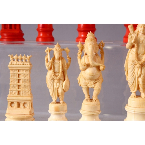 615 - AN EARLY 20TH CENTURY IVORY AND STAINED IVORY INDIAN CHESS SET, carved as Indian gods and temples, l... 