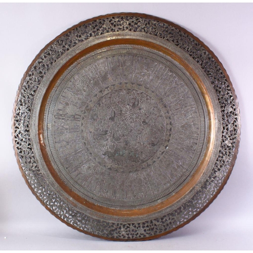 616 - A MONUMENTAL INDIAN ENGRAVED METAL TRAY, with pierced border, 98cm diameter.