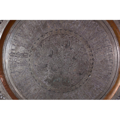 616 - A MONUMENTAL INDIAN ENGRAVED METAL TRAY, with pierced border, 98cm diameter.