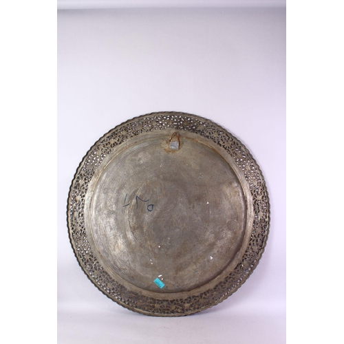 616 - A MONUMENTAL INDIAN ENGRAVED METAL TRAY, with pierced border, 98cm diameter.