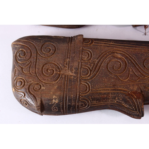 617 - THREE INDIAN CARVED WOODEN SPICE BOXES, largest 40cm long.