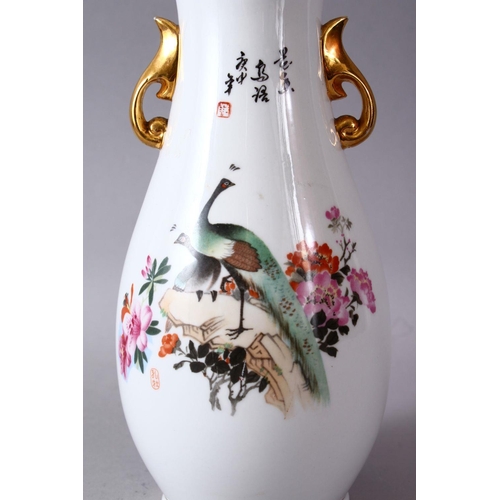 63 - A CHINESE FAMILLE ROSE REPUBLIC STYLE PORCELAIN VASE, with twin peacock and floral decoration, with ... 