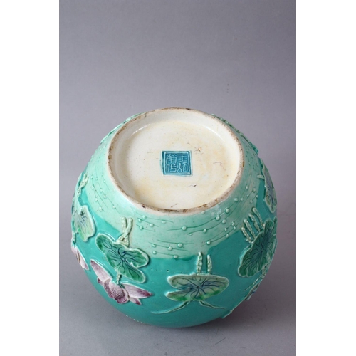 69 - A CHINESE TURQUOISE GROUND PORCELAIN GINGER JAR, with raised relief decoration of a crane amongst lo... 