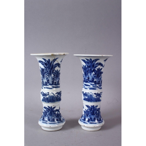 70 - A PAIR OF 19TH CENTURY OR LATER CHINESE BLUE & WHITE PORCELAIN GU VASES, The body of the vases decor... 