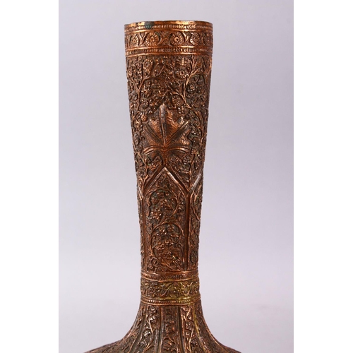 748 - A 19TH / 20TH CENTURY INDIAN KASHMIRI COPPER VASE, decorated with floral motif in relief, 29cm