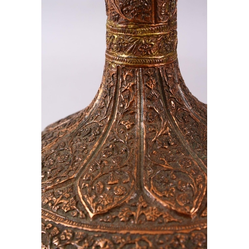 748 - A 19TH / 20TH CENTURY INDIAN KASHMIRI COPPER VASE, decorated with floral motif in relief, 29cm