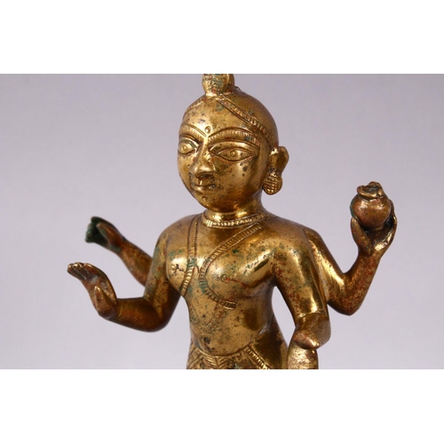 750 - A 19TH / 20TH CENTURY INDIAN BRONZE IGURE OF A DEITY, stood holding a vessel with plated hair, 20cm