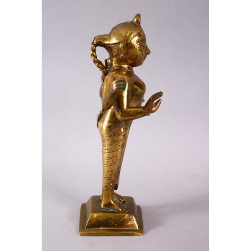 750 - A 19TH / 20TH CENTURY INDIAN BRONZE IGURE OF A DEITY, stood holding a vessel with plated hair, 20cm