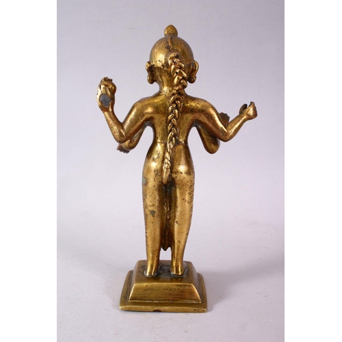 750 - A 19TH / 20TH CENTURY INDIAN BRONZE IGURE OF A DEITY, stood holding a vessel with plated hair, 20cm