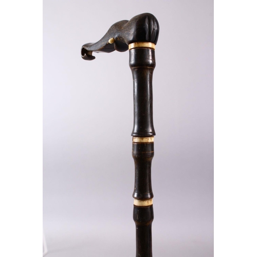 752 - AN 18TH CENTURY MUGHAL RHINO HORN AND BONE WALKING STICK, carved in section with Rhino horn and carv... 