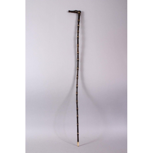 752 - AN 18TH CENTURY MUGHAL RHINO HORN AND BONE WALKING STICK, carved in section with Rhino horn and carv... 