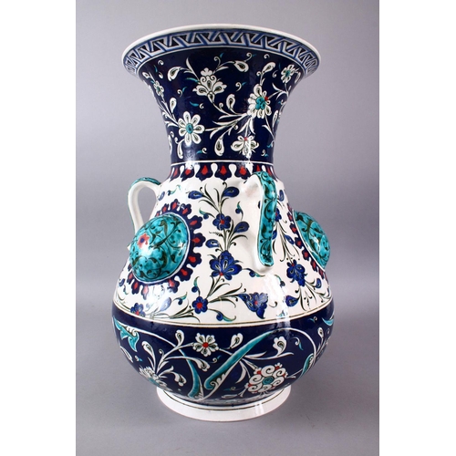 759 - A LARGE TURKISH OTTOMAN STYLE CERAMIC FLORAL LAMP VASE, with three moulded handles and three bosses,... 