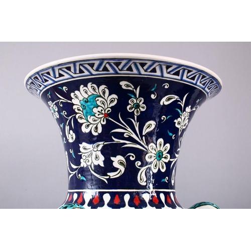 759 - A LARGE TURKISH OTTOMAN STYLE CERAMIC FLORAL LAMP VASE, with three moulded handles and three bosses,... 