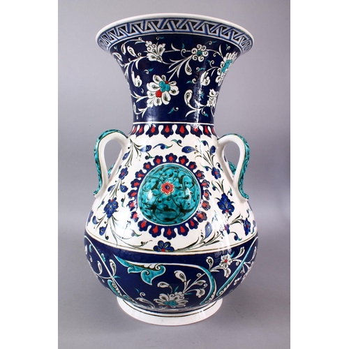 759 - A LARGE TURKISH OTTOMAN STYLE CERAMIC FLORAL LAMP VASE, with three moulded handles and three bosses,... 