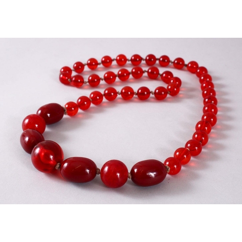 760 - A GOOD SET OF CHERRY AMBER ROSARY BEAD NECKLACE, with graduating bead size, approx open size 84cm.