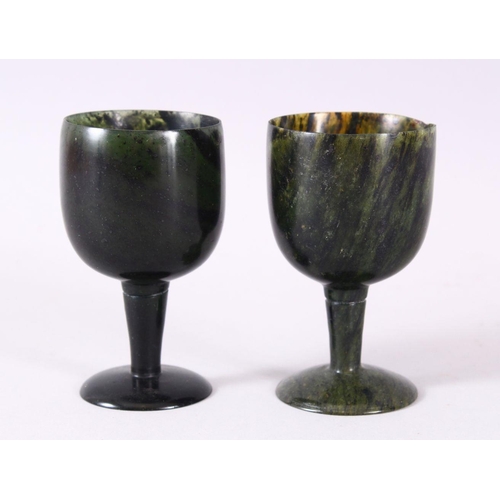 761 - A GOOD PAIR OF MUGHAL CARVED SPINACH GREEN JADE GOBLETS, 10cm high X 5.6cm diameter