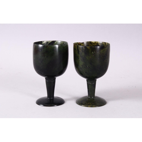 761 - A GOOD PAIR OF MUGHAL CARVED SPINACH GREEN JADE GOBLETS, 10cm high X 5.6cm diameter