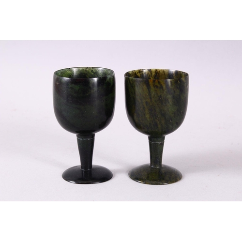 761 - A GOOD PAIR OF MUGHAL CARVED SPINACH GREEN JADE GOBLETS, 10cm high X 5.6cm diameter