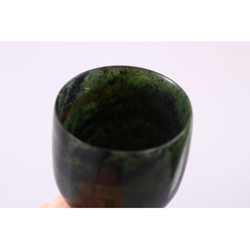 761 - A GOOD PAIR OF MUGHAL CARVED SPINACH GREEN JADE GOBLETS, 10cm high X 5.6cm diameter