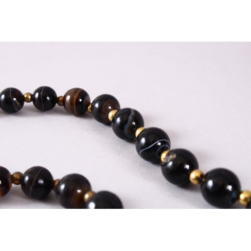 763 - A GOOD SET OF VICTORIAN CARVED AGATE ROSARY BEADS, in mont blanc style colours, dark brown to transl... 