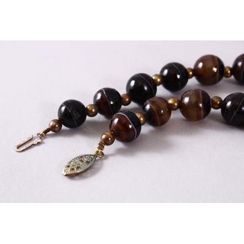 763 - A GOOD SET OF VICTORIAN CARVED AGATE ROSARY BEADS, in mont blanc style colours, dark brown to transl... 