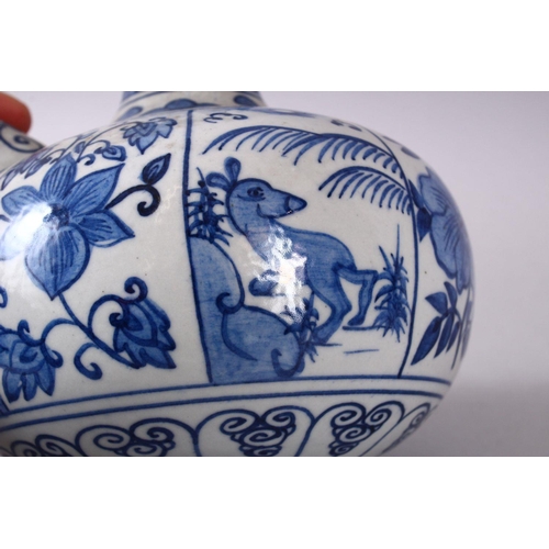 765 - A CHINESE BLUE & WHITE PORCELAIN POURING VESSEL - FOR THE ISLAMIC MARKET, decorated with panles of d... 