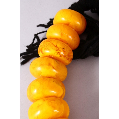 766 - A LARGE SET OF TURKISH? PRESSED AMBER BEAD NECKLACE, 20 beads, each bead approx. 5cm, overall approx... 