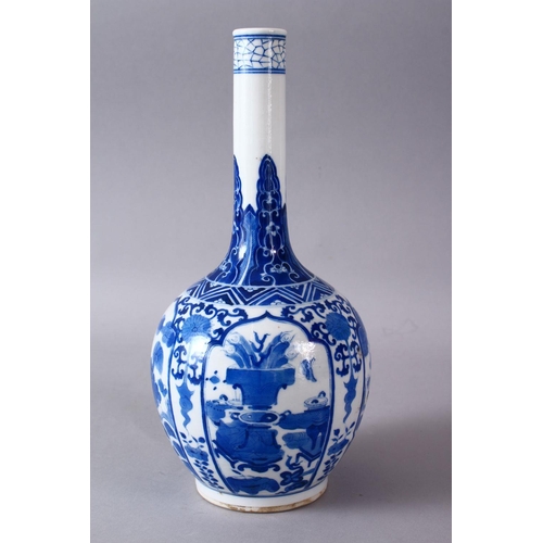 77 - A CHINESE KANGXI STYLE BLUE & WHITE PORCELAIN BOTTLE VASE, with panel decoration of lion dogs and fl... 