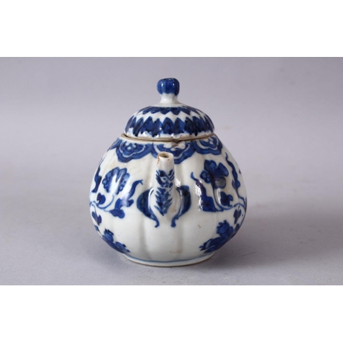 79 - A 19TH / 20TH CENTURY CHINESE BLUE & WHITE PORCELAIN TEAPOT, decorated with f lotus display, and flo... 